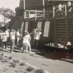 People reviewing scoreboards and gathering at Sea Mountain Golf Course clubhouse near Punaluʻu, Kaʻū Hawaiʻi, early 1970s